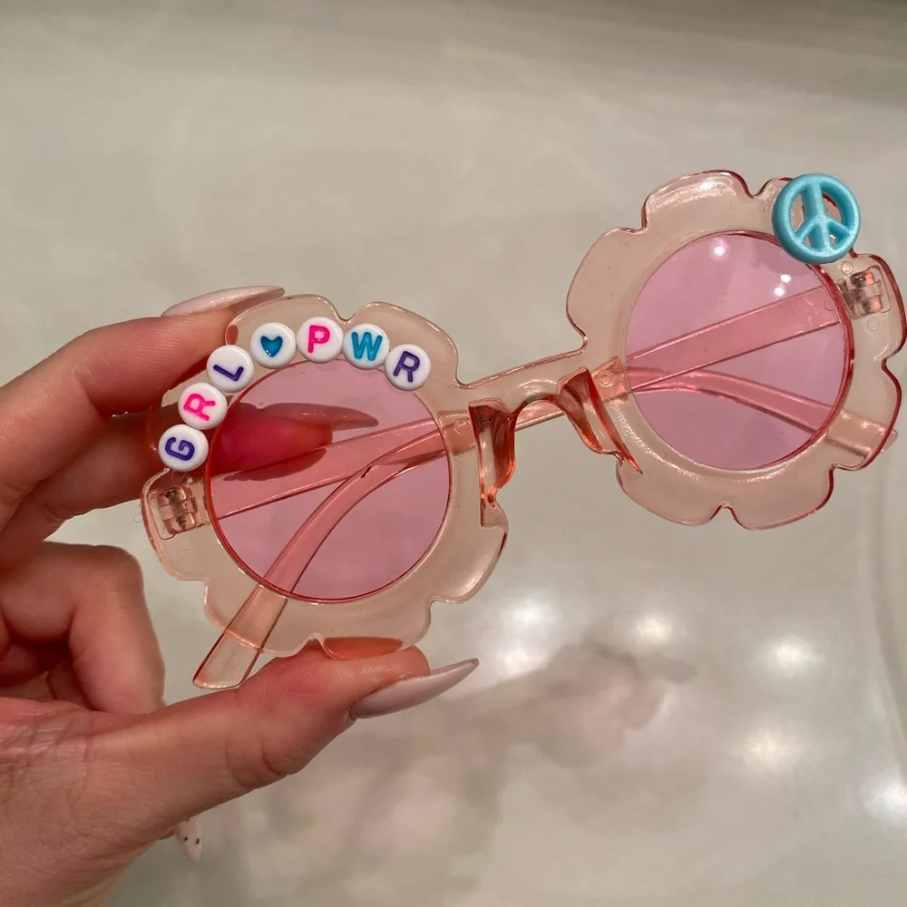 Girls pink see through flower shaped grl pwr sunglasses